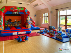 Pirate Bounce and Slide with pirate soft play and matching red mats.