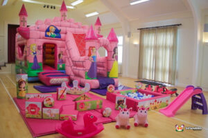 girls bouncy castle with unicorn hoppers and plasma cars