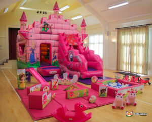 pink bouncy castle and pink soft play