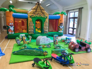 large amazonian jungle themed inflatable with jungle animal themed soft play spaces and safari car